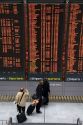 Departure board located in the Paris-Charles de Gaulle Airport, Paris, France.