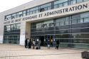 Students socialize in front of the Paul Verlaine University administrative building in Metz, France.