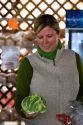 Woman holding a Romanesco broccoli at a farmers market in Fruitland, Idaho. MR