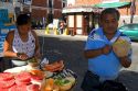 Street vendor carving and selling melon in the city of Puebla, Puebla, Mexico.