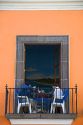 People dine on a restaurant balcony in the city of Puebla, Puebla, Mexico.