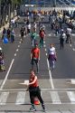 Pedestrians and bicyclists traveling on the Paseo de la Reforma on a Sunday in Mexico City, Mexico.