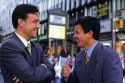 Chilean businessmen talk on the street in Santiago, Chile.
