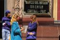 Businesswomen have a conversation on the street in Santiago, Chile.