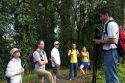 Naturalist guide talking to a group of birdwatchers in the Arenal Volcano National Park near La Fortuna, San Carlos, Costa Rica.