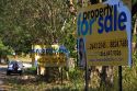 Real estate signage along Highway 1 near Quebrada, Costa Rica.