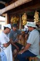 Server and customers at an outdoor cafe in Quepos, Costa Rica.