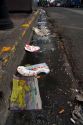 Trash lines the gutter of a street in San Jose, Costa Rica.