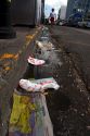 Trash lines the gutter of a street in San Jose, Costa Rica.