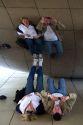 Visitors look at their reflection in the Cloud Gate public sculpture located at the AT&T Plaza in Millennium Park, Chicago, Illinois.