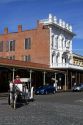 Tourists ride in a horse drawn carriage at Old Sacramento State Historic Park in Sacramento, Califorina, USA.