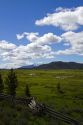 Split rail fencing runs through a meadow near Stanley, Idaho, USA.