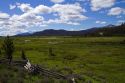 Split rail fencing runs through a meadow near Stanley, Idaho, USA.