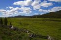 Split rail fencing runs through a meadow near Stanley, Idaho, USA.