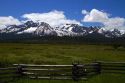 Split rail fencing runs through a meadow near Stanley, Idaho, USA.