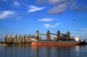 Bulk freighter at a grain shipping terminal on the Mississippi River at the Port of Baton Rouge, Louisiana, USA.