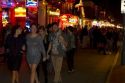 Neon signs of bars and restaurants along Bourbon Street in the French Quarter of New Orleans, Louisiana, USA.