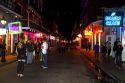 Neon signs of bars and restaurants along Bourbon Street in the French Quarter of New Orleans, Louisiana, USA.