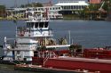 Tug boat and river barge on the Mississippi River at New Orleans, Louisiana, USA.