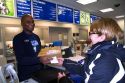 Female customer and male african american postal worker in Boise, Idaho, USA.