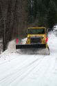 Snowplow removing snow from the road at Grimes Creek, Boise County, Idaho, USA.