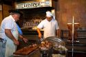 Chefs cooking meat at La Estancia restaurant in Bueos Aires, Argentina.