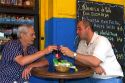 Argentine men dine at a cafe in the La Boca barrio of Buenos Aires, Argentina.