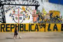 Argentine boy playing soccer in the La Boca barrio of Buenos Aires, Argentina.