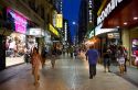 People walking on Lavalle Street at night in Buenos Aires, Argentina.