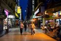 People walking on Lavalle Street at night in Buenos Aires, Argentina.