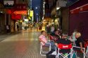 People walking on Lavalle Street at night in Buenos Aires, Argentina.