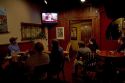People watch President Obama on the television announcing the death of Osama Bin Laden at a restaurant in Boise, Idaho, USA.