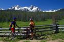 Touring bicyclists stop for a view of the Sawtooth Mountain Range near Stanley, Idaho, USA.