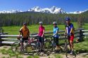 Touring bicyclists stop for a view of the Sawtooth Mountain Range near Stanley, Idaho, USA.