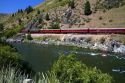 The Thunder Mountain Line scenic tourist train traveling along the Payette River between Horseshoe Bend and Banks, Idaho, USA.
