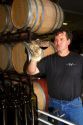 Winemaker tasting red wine at Woodriver Cellars in Eagle, Idaho, USA.