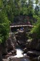 Waterfall and footbridge on the Temperance River near Tofte in northern Minnesota, USA.