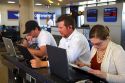 People use wi-fi internet at the Phoenix Sky Harbor International Airport located in the city of Phoenix, Arizona, USA.