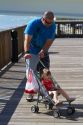 Family on the boardwalk at Johns Pass Village located on the waterfront at Madeira Beach, Florida, USA.