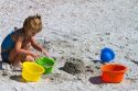 Four year girl playing at Madeira Beach in Pinellas County, Florida, USA.