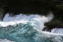 Pacific ocean waves crash against the lava peninsula of Kilauea Point National Wildlife Refuge on the island of Kauai, Hawaii, USA.