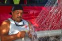 Native hawaiian fisherman mending a net on the island of Kauai, Hawaii, USA. MR