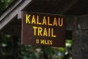 Kalalau trailhead sign marking a trail along the Na Pali Coast on the island of Kauai, Hawaii, USA.