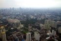 View of the Bangkok cityscape taken from the Baiyoke Tower II showing air pollution and smog, Thailand.
