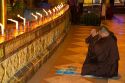 Buddhist monk praying at the Shwedagon Paya located in (Rangoon)Yangon, (Burma) Myanmar.