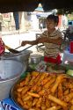 Street food vendor selling eggrolls in (Rangoon) Yangon, (Burma) Myanmar.