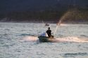 Man riding a personal water craft in the Gulf of Thailand at Chaweng beach on the island of Ko Samui, Thailand.