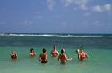 People play volleyball in the Gulf of Thailand at Chaweng beach on the island of Ko Samui, Thailand.