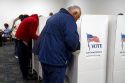People vote in cardboard voting booths at a polling station in Boise, Idaho, USA.