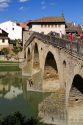 Six-arched Roman bridge spanning the Arga River on the Way of St. James pilgrimage route in Puente La Reina, Navarra, Spain.